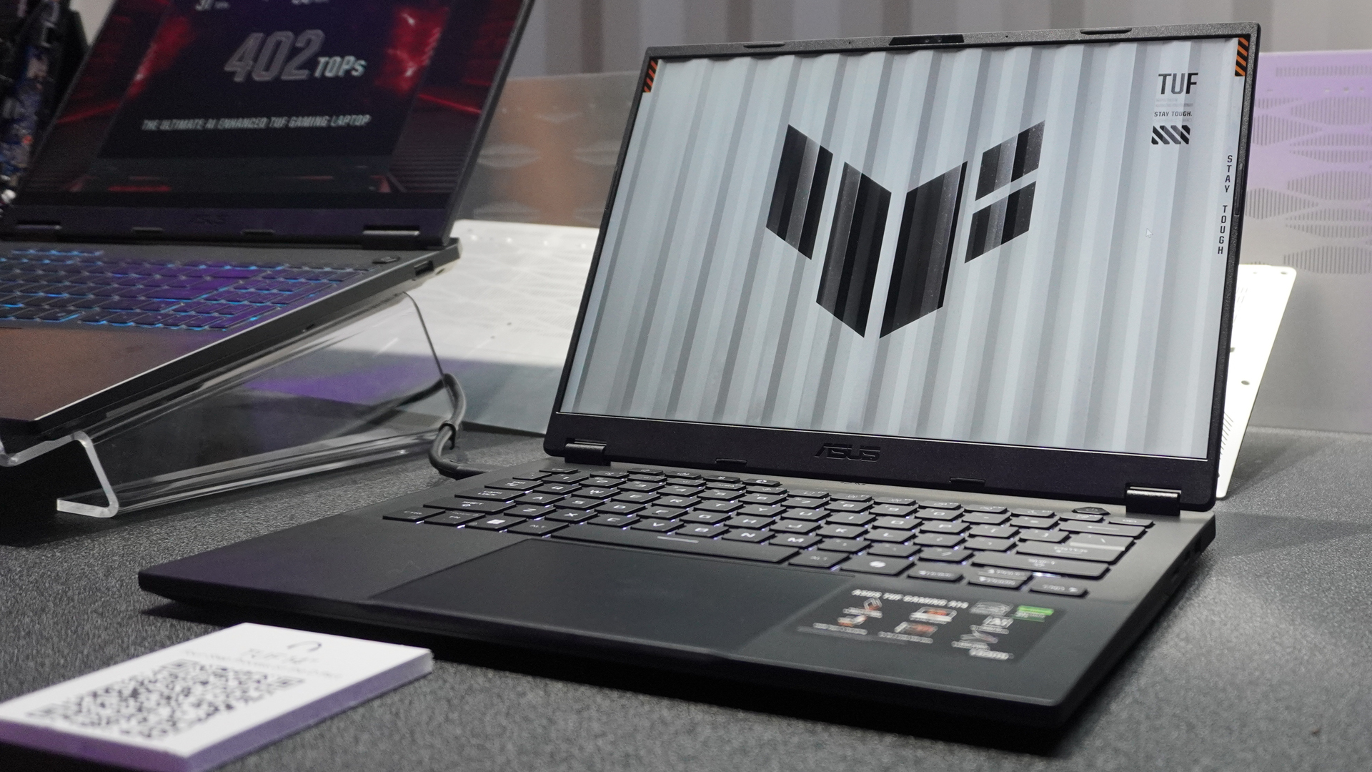 Asus TUF Gaming A14 laptop on a desk at Computex 2024.