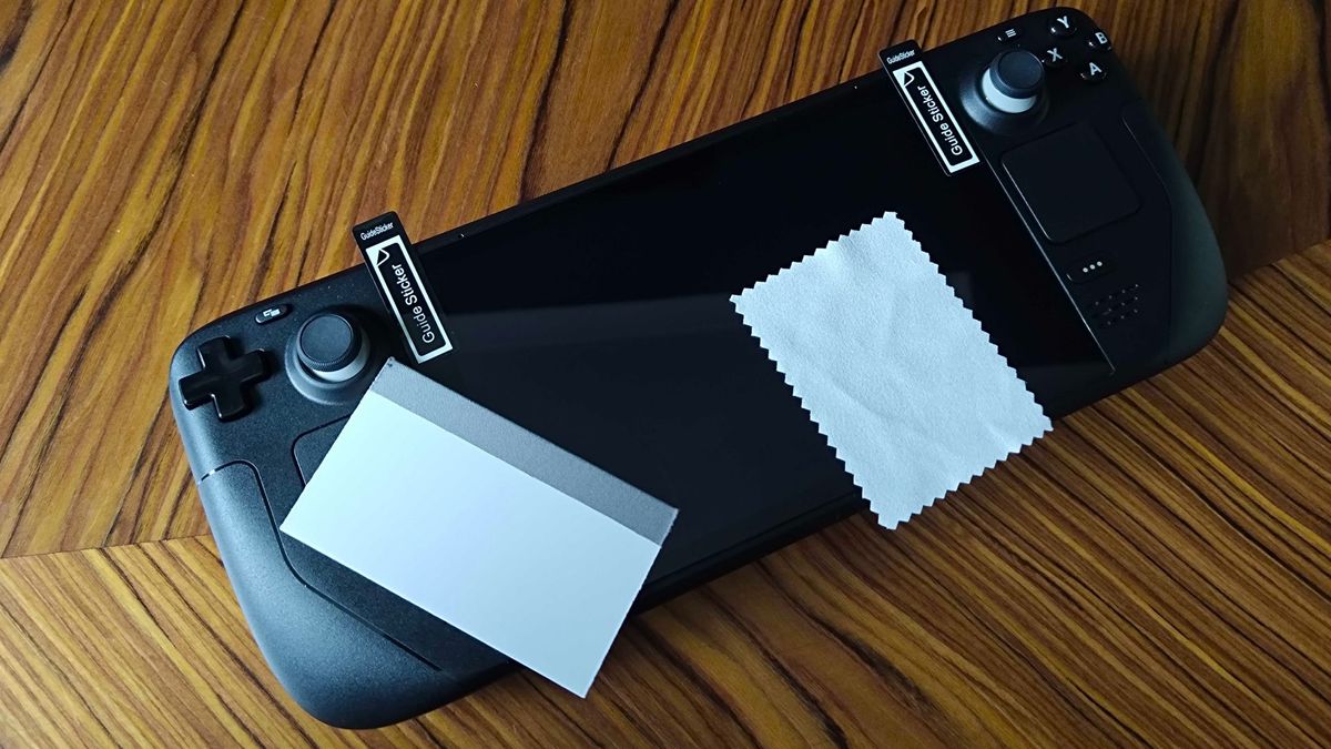 Jsaux screen protector for Steam Deck applied to handheld with guiding stickers, microfibre cloth, and applicator