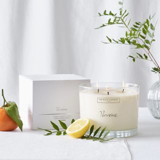 The White Company candle styled with a real lemon and orange