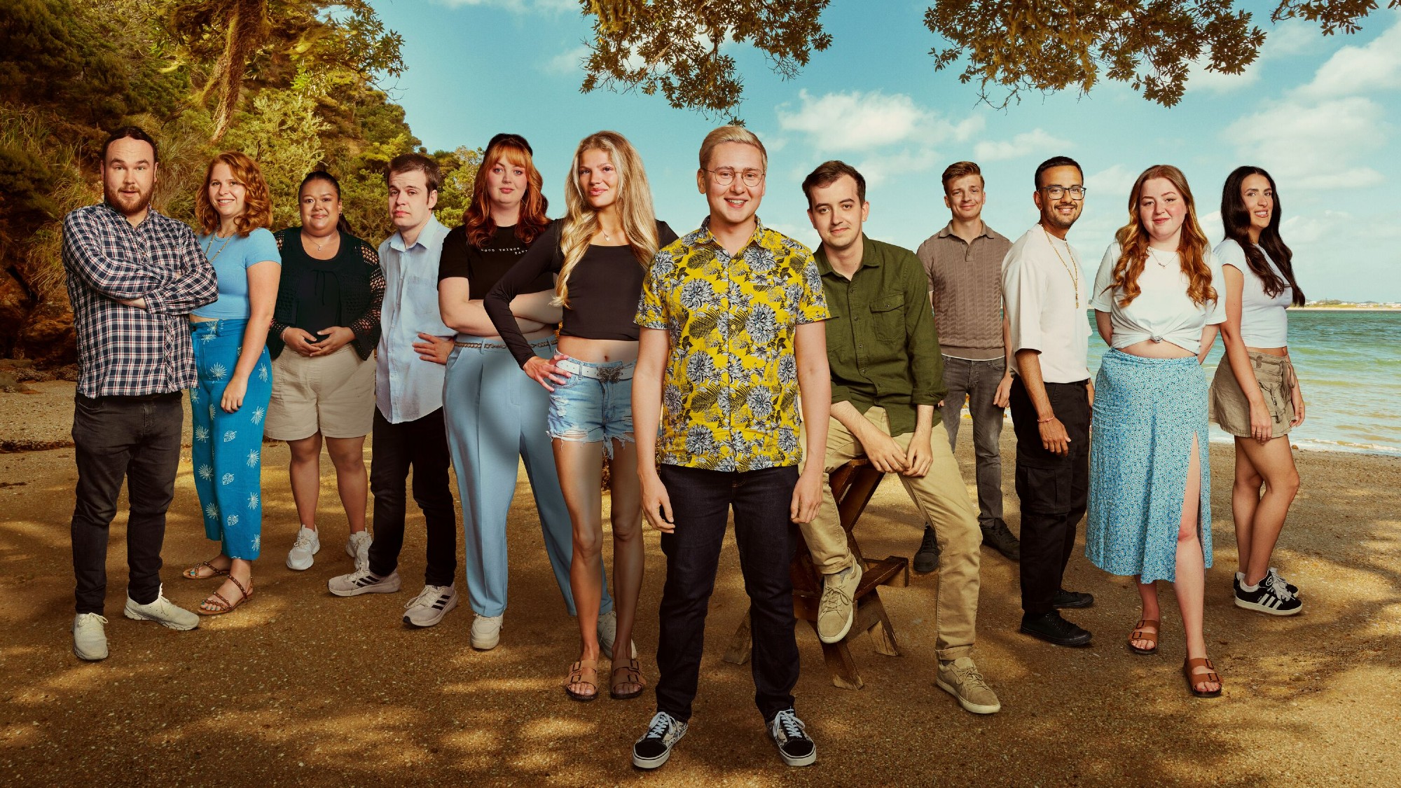 A publicity image showing participants of Virgin Island against the backdrop of a beach