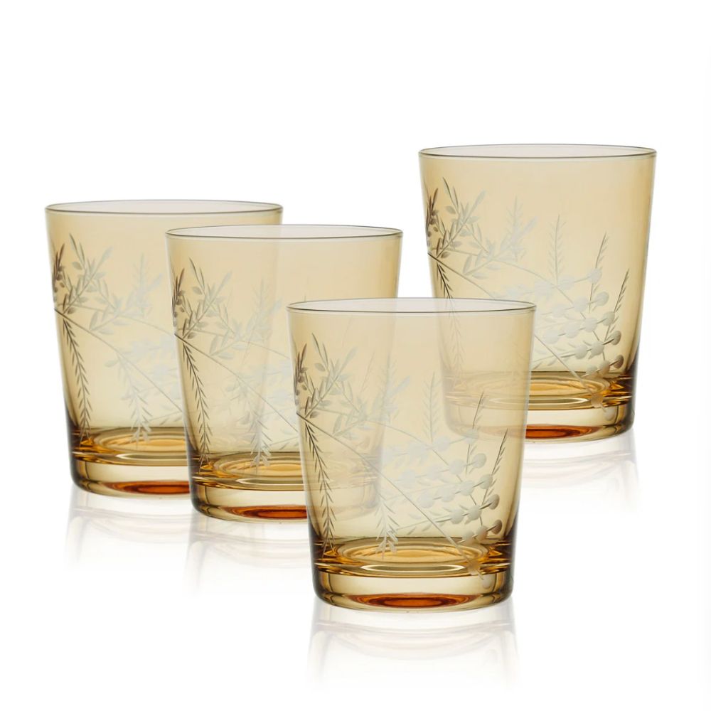 Four amber colored drinking glasses wth etched pattern