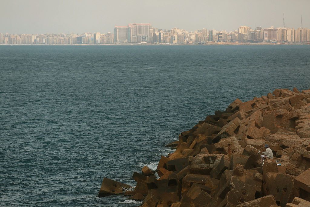 A fisherman looks out over the Mediterranean Sea from the coastline of Alexandria where about 290 kilometers north, search operations are taking place to locate the wreckage of EgyptAir fligh