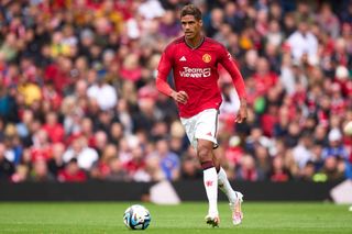 Raphael Varane of Manchester United runs with the ball during the pre-season friendly match between Manchester United and RC Lens at Old Trafford on August 05, 2023 in Manchester, England. (Photo by Alex Caparros/Getty Images)
