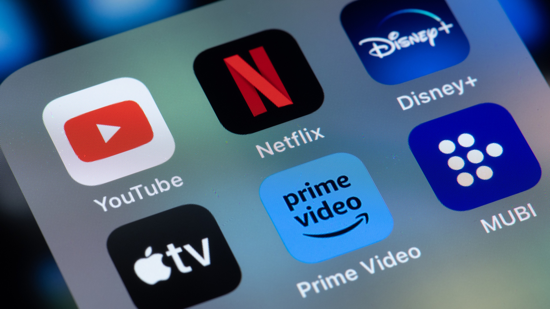 Streaming platform apps Netflix, Amazon Prime, Mubi, YouTube, Disney Plus and Apple TV on an iPhone screen.