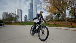 Man riding Serial One Mosh/Cty e-bike in a city
