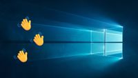 Emoji hands waving goodbye to the Windows 10 wallpaper