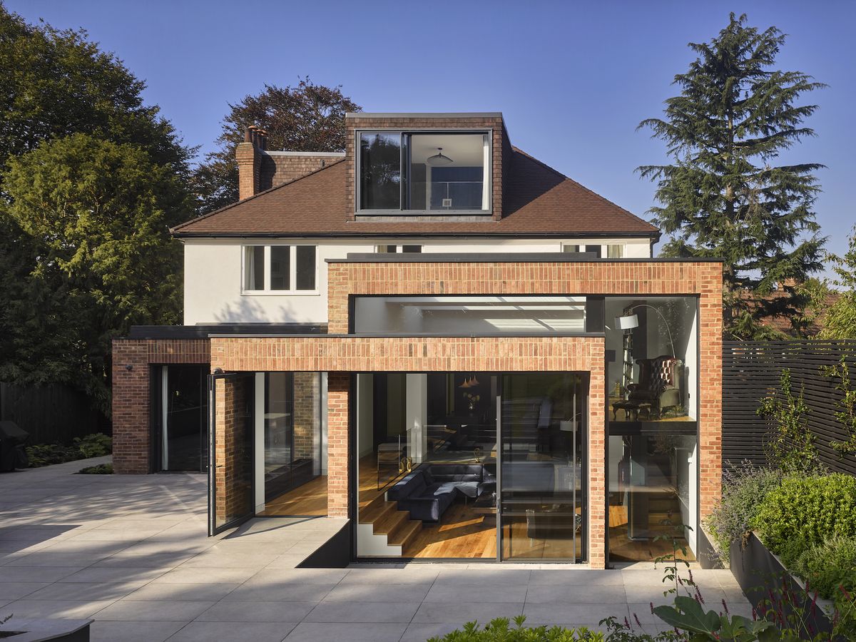 brick clad extension to white rendered house