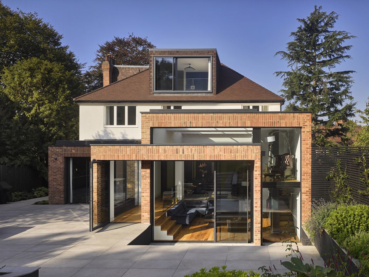 brick clad extension to white rendered house