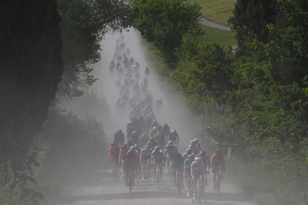 RAPOLANO TERME ITALY MAY 09 Tadej Pogacar of Slovenia and UAE Team Emirates Pink Leader Jersey Davide Ballerini of Italy and Astana Qazaqstan Team Jonathan Milan of Italy and Team Lidl Trek Purple Points Jersey and a general view of the peloton competing during the 107th Giro dItalia 2024 Stage 6 a 180km stage from Viareggio to Rapolano terme 322m UCIWT on May 09 2024 in Rapolano terme Italy Photo by Tim de WaeleGetty Images