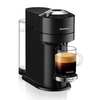 A Nespresso Vertuo Next coffee maker with a double espresso on a white background