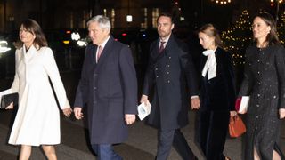 Carole Middleton wears a white coat and is joined by Pippa Middleton in a black sparkly coat and their family members for Kate Middleton's Christmas carol concert