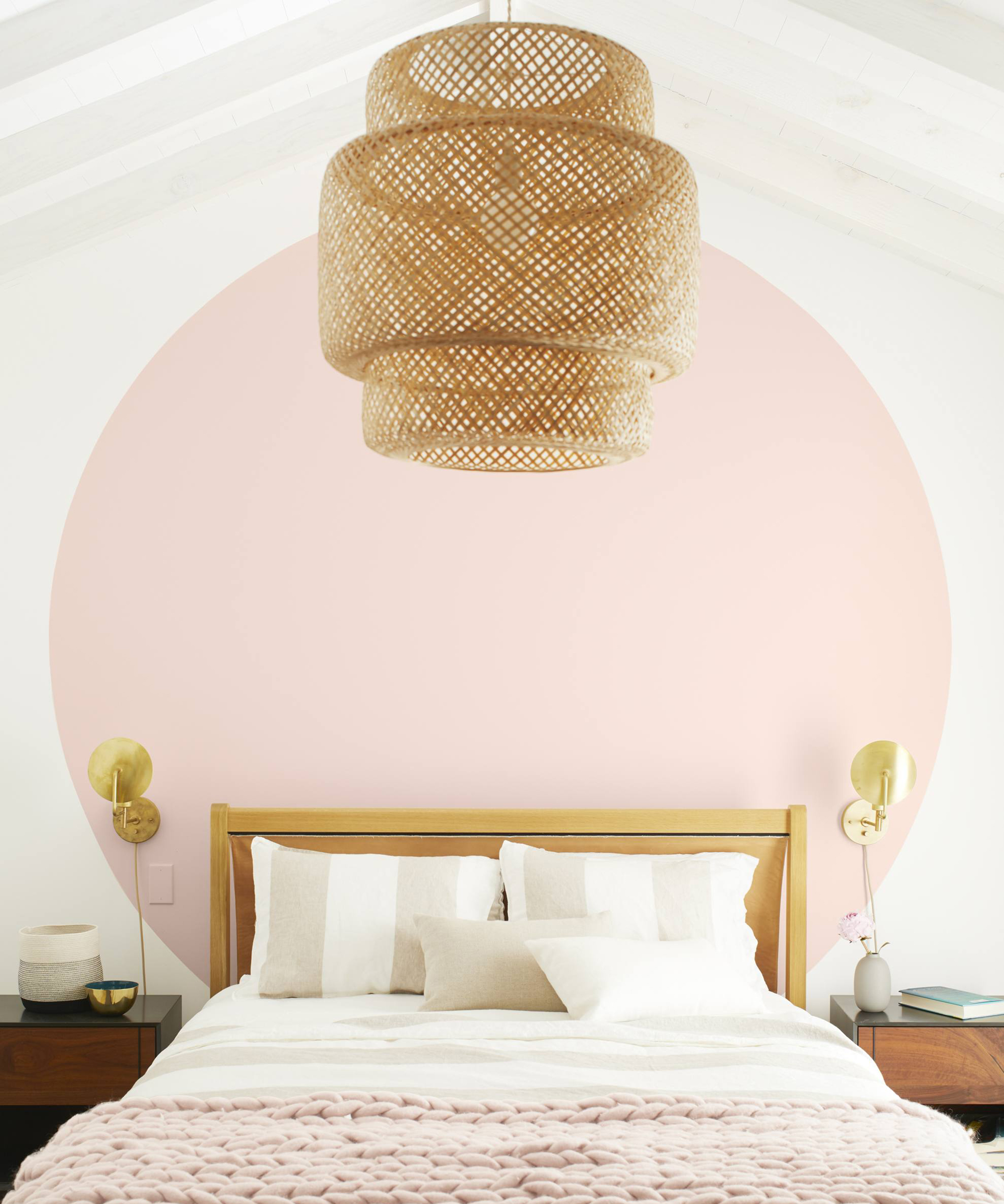 A bedroom using Benjamin Moore Colour Of The Year 2020 First Light 2102 70 Regal Select Matte paints on feature wall and rattan lantern light