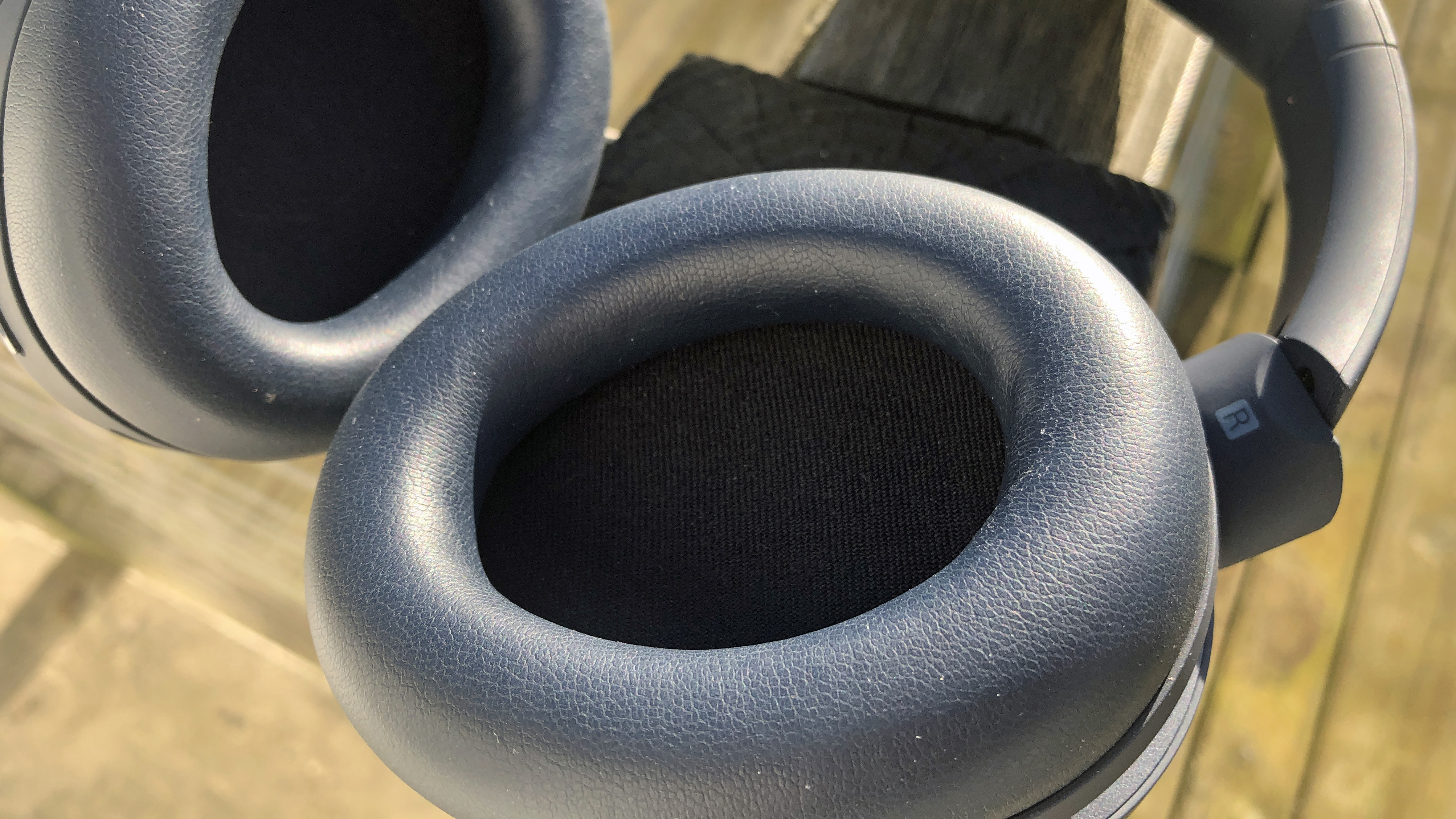 a closeup of the earcups on the cleer audio alpha headphones