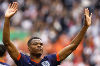 Denzel Dumfries celebrates after the Netherlands beat Poland in their opening game at Euro 2024.