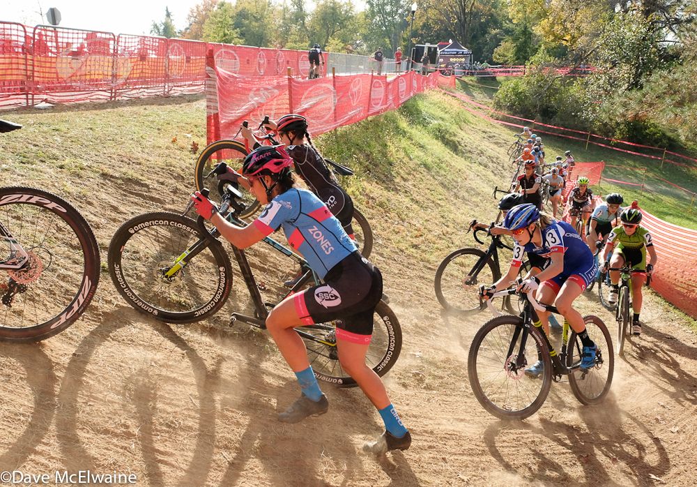 Courtenay McFadden (American Classic) pushing her bike on an uphill switchback.