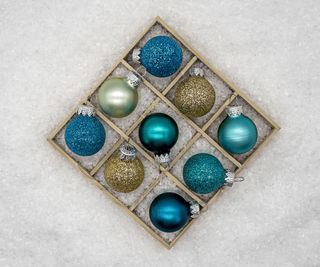 Blue baubles in a divided ornament storage box