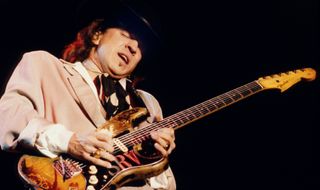 Stevie Ray Vaughan performs onstage in 1989