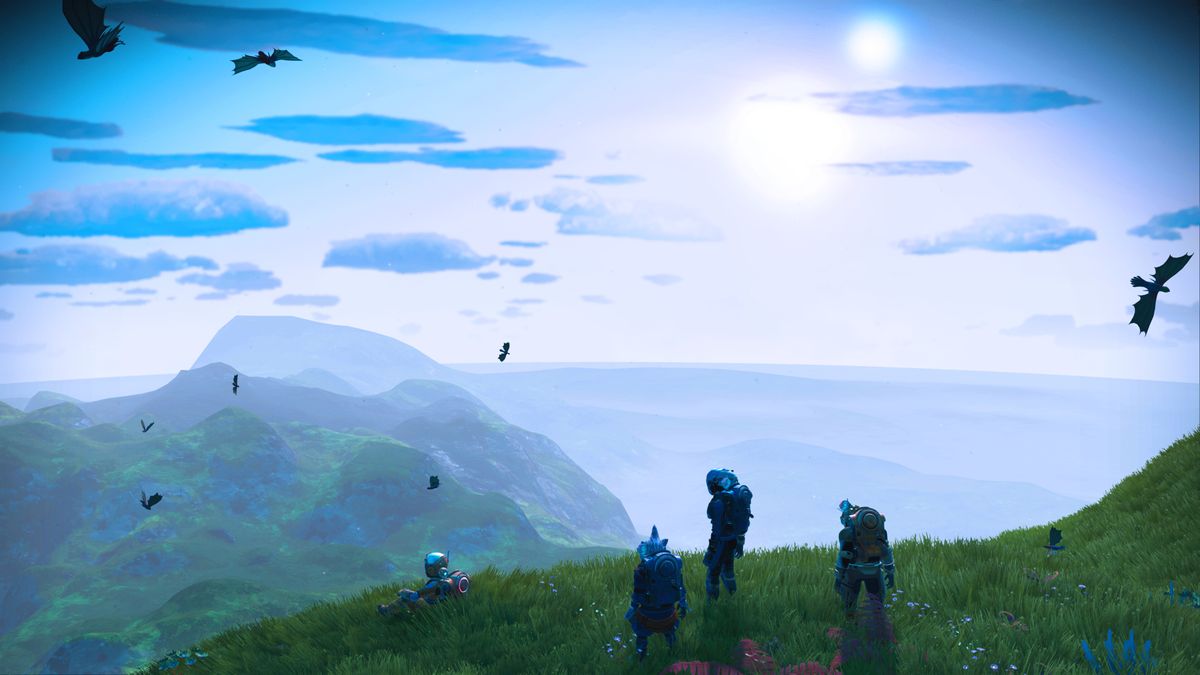 Space explorers looking out over a planet in No Man&#039;s Sky.