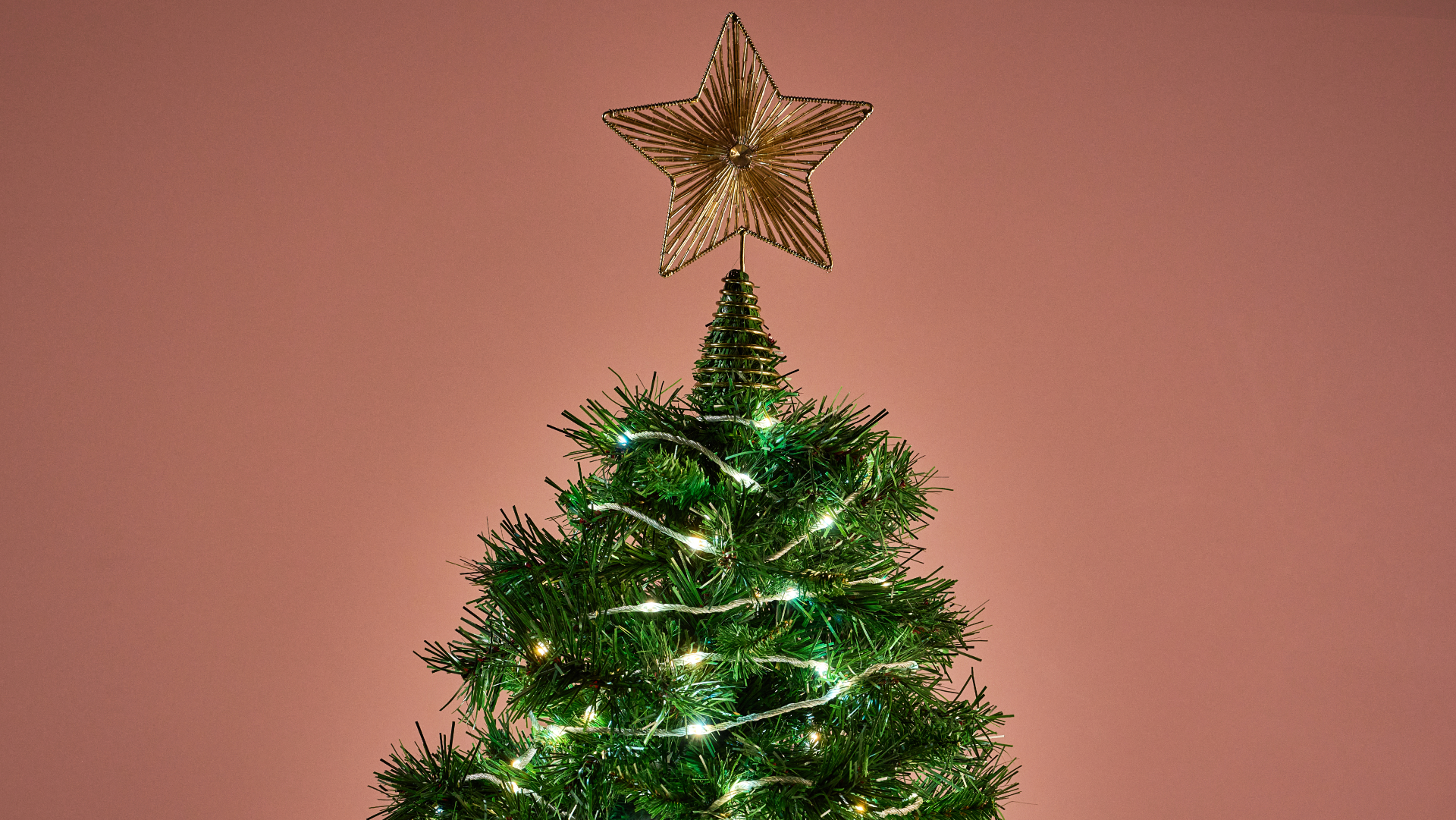 The Govee Christmas String Lights 2 are glowing white on a Christmas tree.