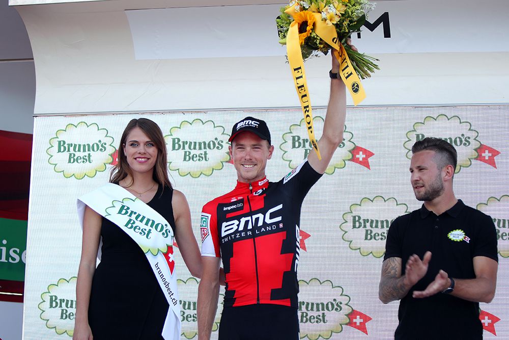 Rohan Dennis on the stage 1 podium at Tour de Suisse