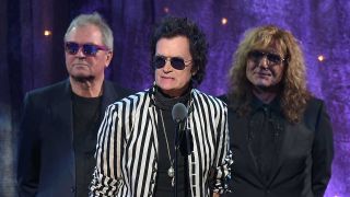 Ian Gillan, Glenn Hughes and David Coverdale onstage at Deep Purple's Rock & Roll Hall Of Fame induction