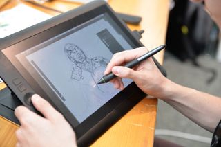Digital Artist Using Pen Display Tablet