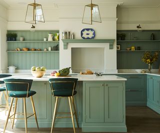 pale green kitchen with large kitchen island