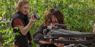 Dwight with a gun on Daryl