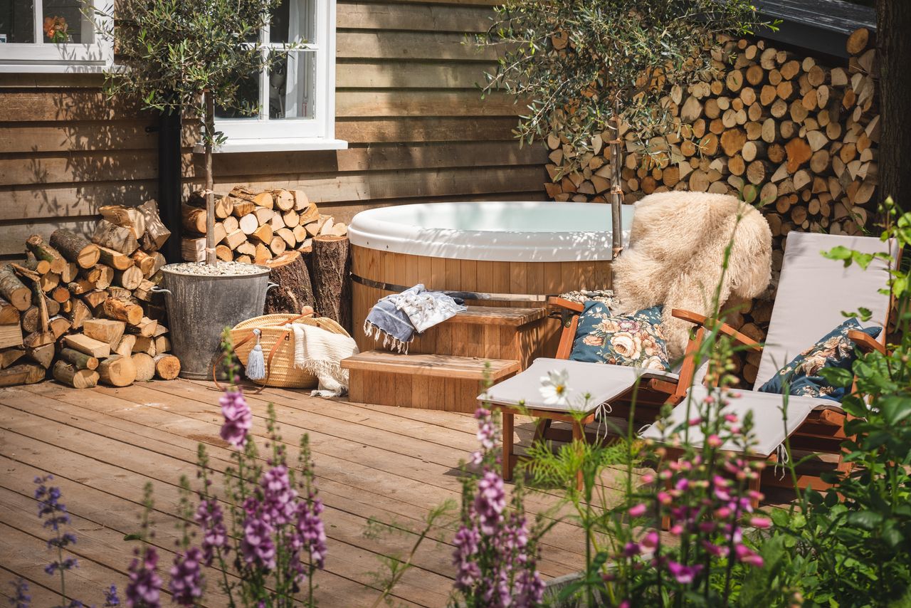 a rustic deck with a hot tub 