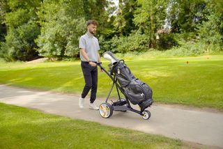 Dan Parker testing the Golfstream Vision Brake trolley on a golf course