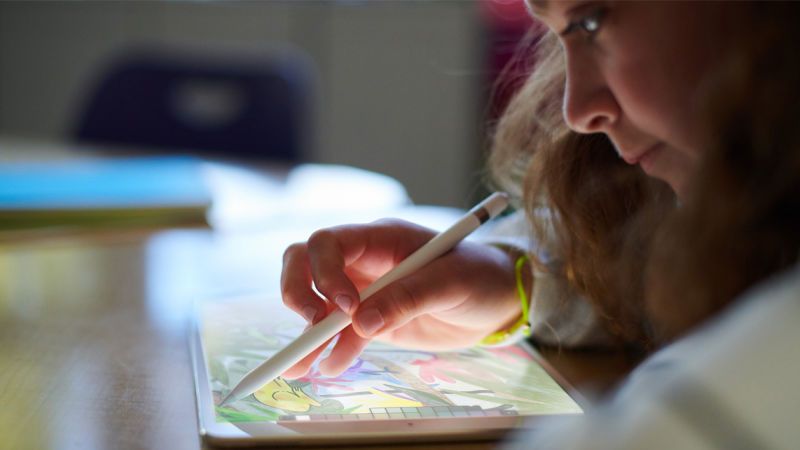 Girl using a Pencil on an iPad