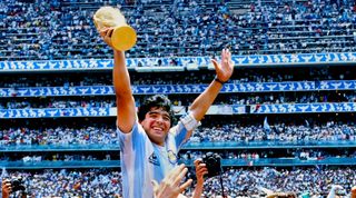 Diego Maradona holds the World Cup trophy aloft after victory in Mexico on June 19th, 1986.