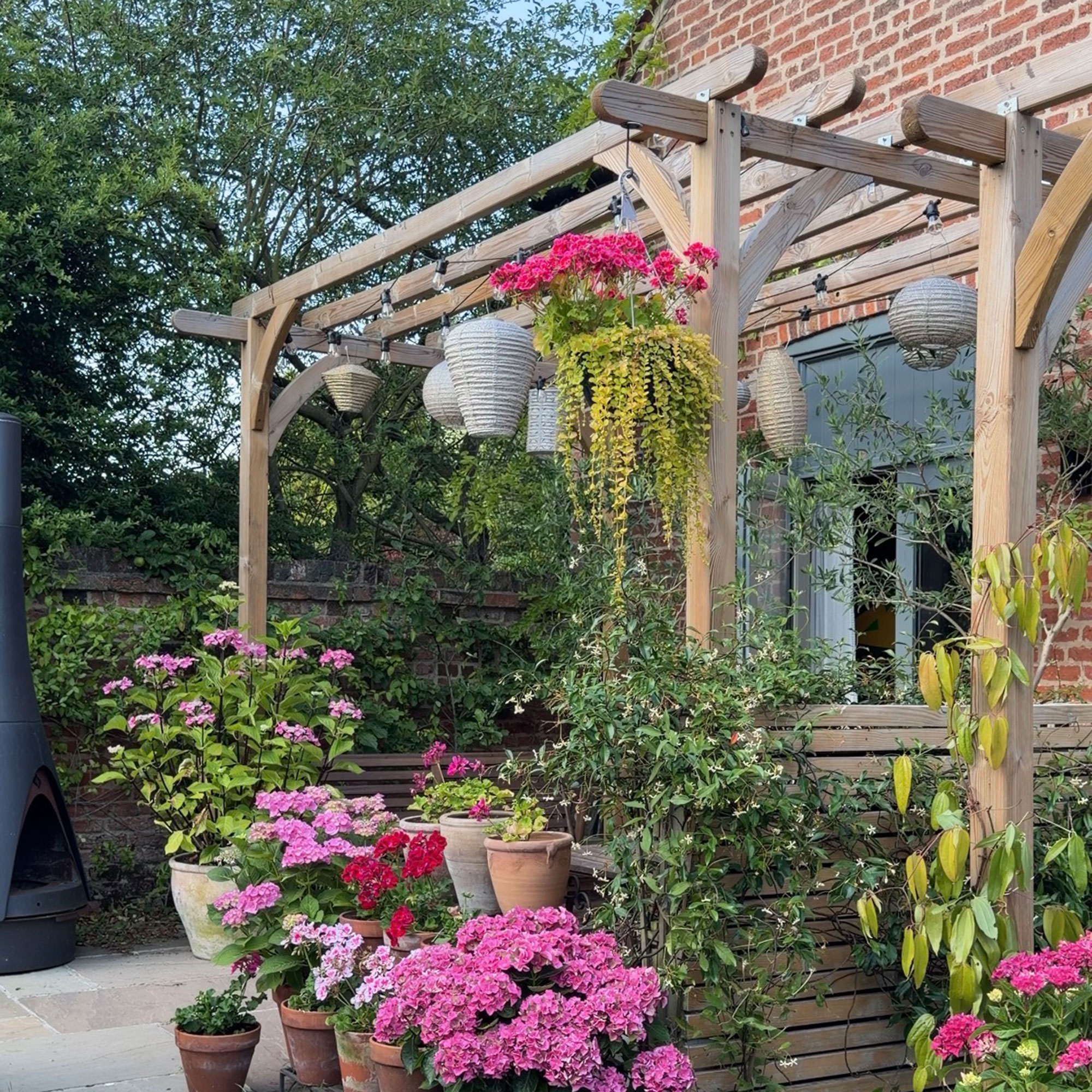 Pergola with lanterns and festoon lights