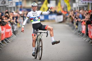 Mathieu Van Der Poel celebrates as he crosses the finish line to win the Vlaamse Druivencross cyclocross Overijse.