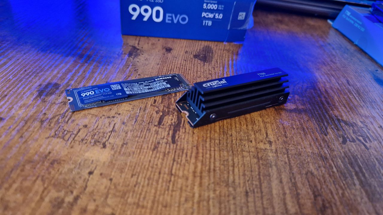 Samsung 990 EVO sitting next to a Crucial T700 Pro, showing the size disparity between the two