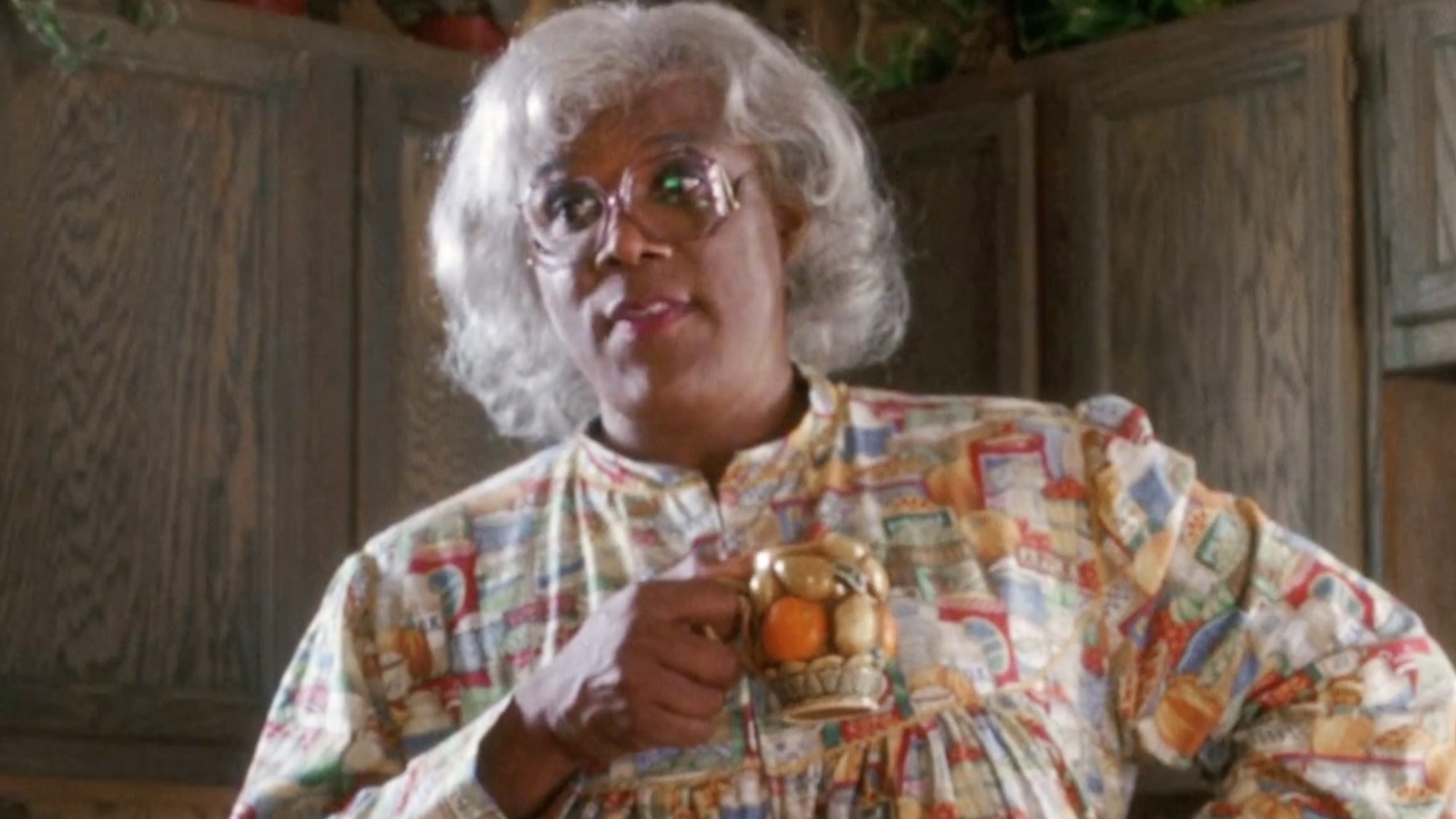 Tyler Perry holding a cup ini Diary of a Mad Black Woman