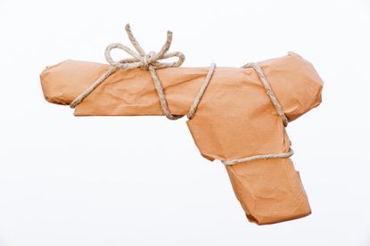 Gun in wrapping paper. 