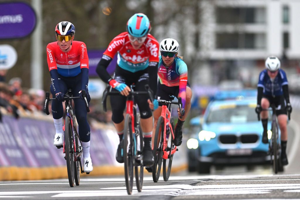 NINOVE BELGIUM FEBRUARY 24 Demi Vollering of The Netherlands and Team SD WorxProtime L crosses the finish line during the 16th Omloop Het Nieuwsblad 2024 Womens Elite a 1271km one day race from Ghent to Ninove UCIWWT on February 24 2024 in Ninove Belgium Photo by Luc ClaessenGetty Images