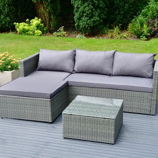 grey sofa with pillow and garden