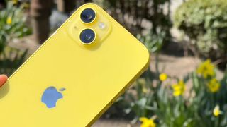 Yellow iPhone 14 Plus outside