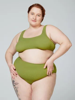 model wears green bikini set