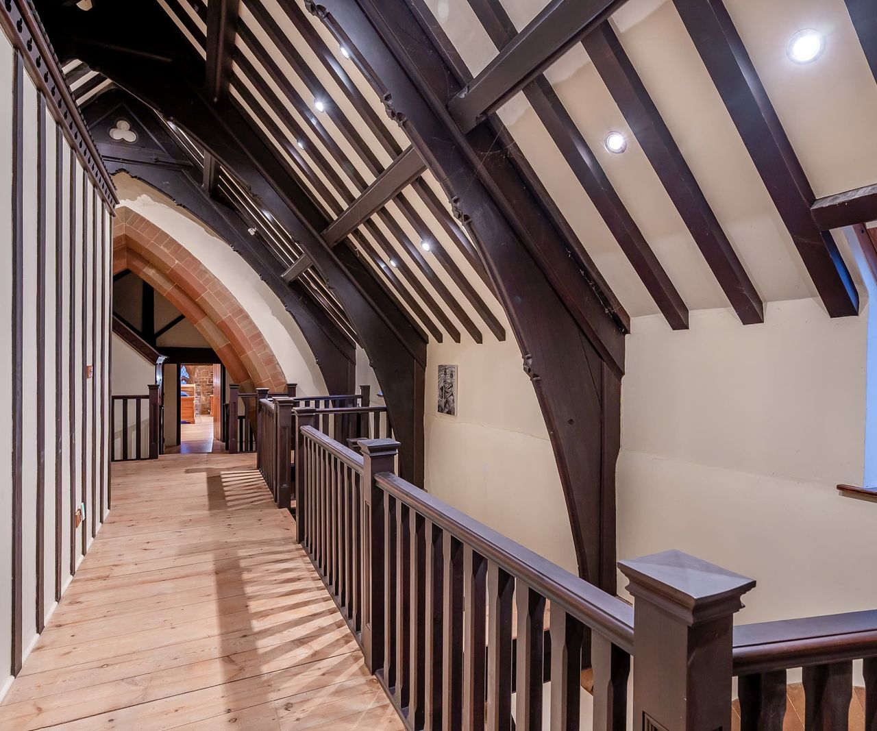 A vaulted ceiling with wooden beams
