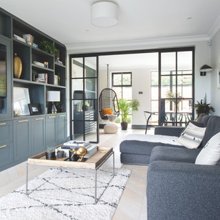 Open plan living and dining room separated by crittal doors