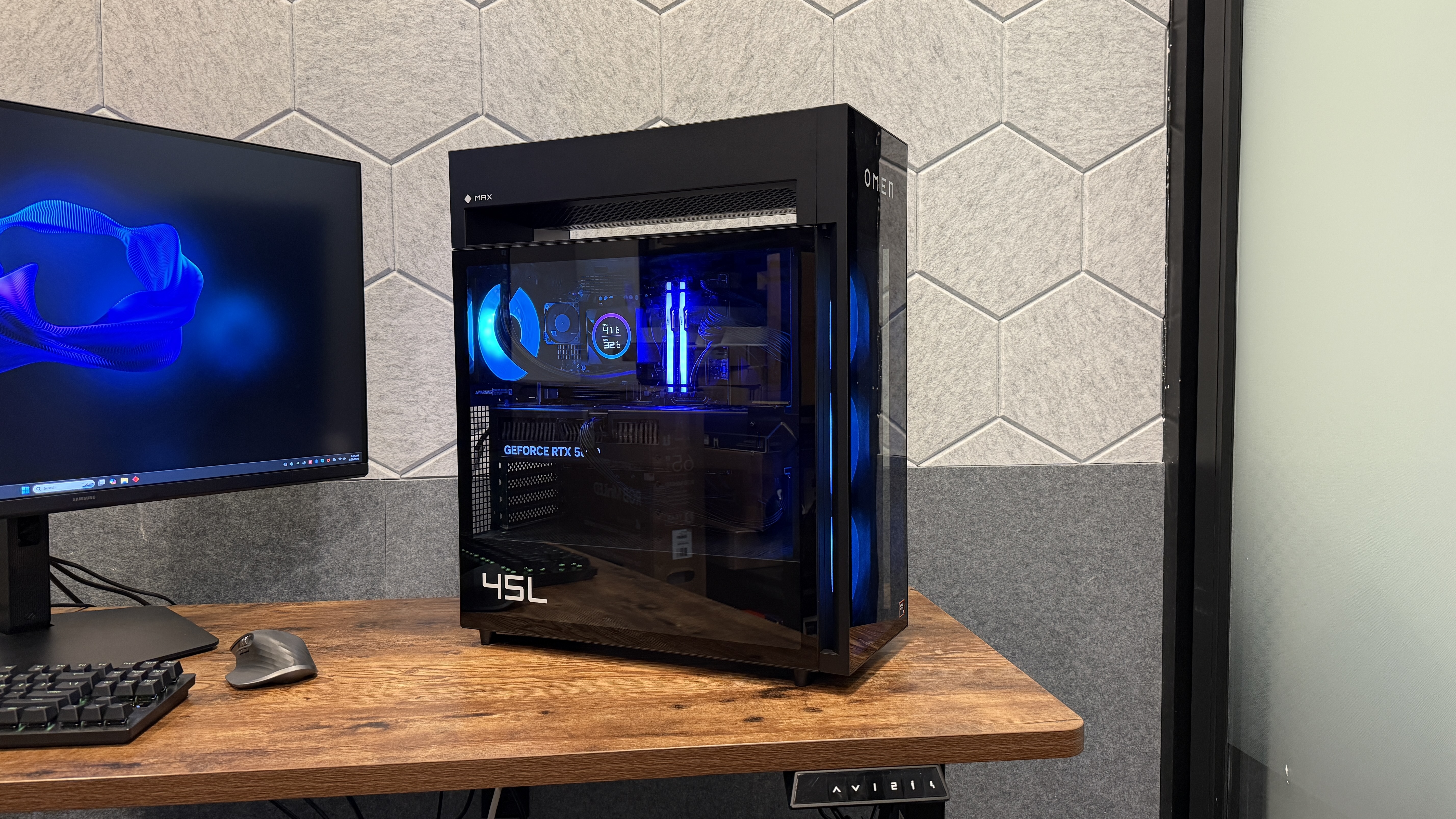 The HP Omen Max 45L gaming PC seen from the side on top of a desk