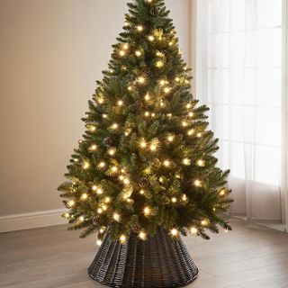 B&M 6ft pre-lit rose-gold tipped Christmas tree with wicker tree skirt