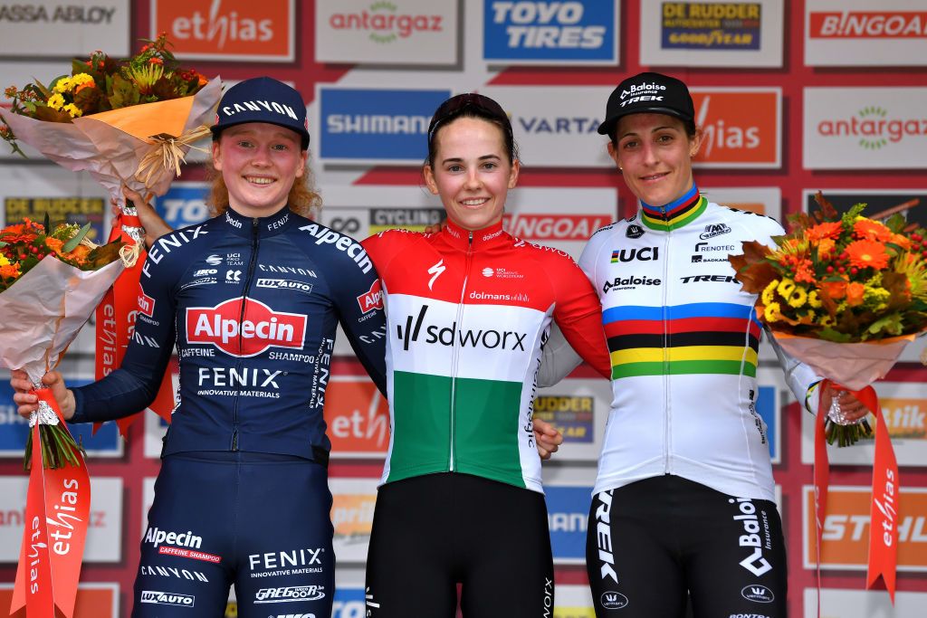 OVERIJSE BELGIUM OCTOBER 31 LR Puck Pieterse of The Netherlands and Team Alpecin Fenix on second place race winner Blanka Vas Kata of Hungary Team SD Worx and Lucinda Brand of The Netherlands and Team Baloise Trek Lions on third place pose on the podium ceremony after the 62nd Druivencross Overijse UCI CycloCross Worldcup 2021 Womens Elite DruivencrossOverijse CXWorldCup UCIcyclocrossWC on October 31 2021 in Overijse Belgium Photo by Luc ClaessenGetty Images