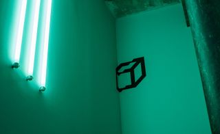 Room includes fluorescent lighting installations