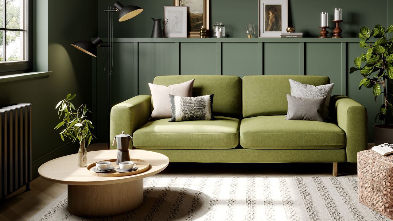 Snug The Big Chill 3 Seater Sofa Metal Legs in Moss in a green-painted panelled living room with a round coffee table