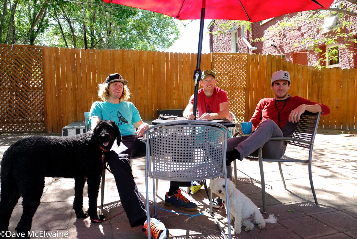 Kona racers Barry Wicks, Kris Sneddon, and Spencer Paxson relaxing with their dogs on Friday evening.
