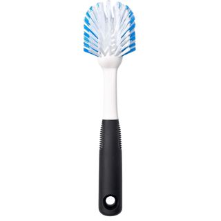 OXO good grips dish brush with black handle and white and blue bristles